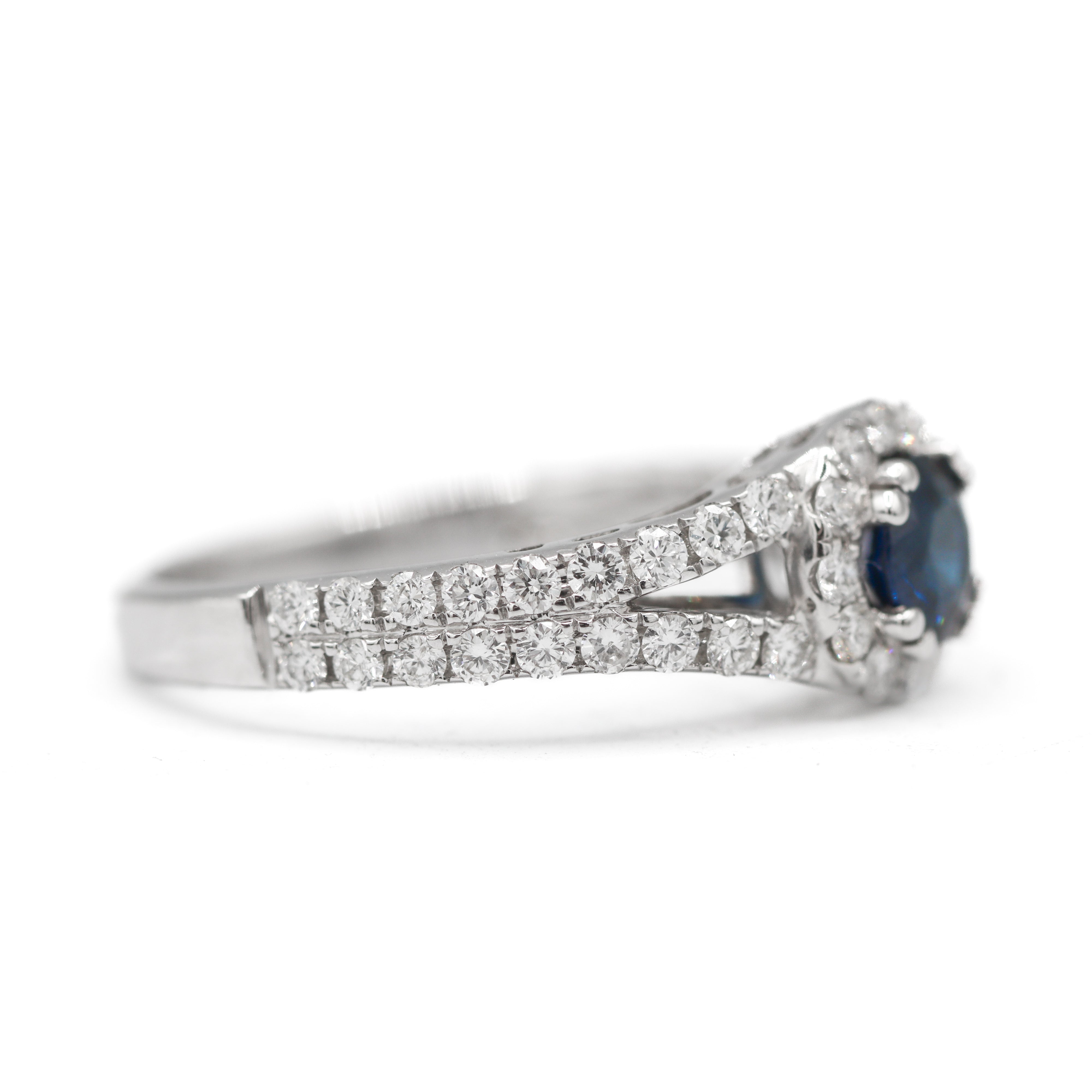 Right side view of 18K White Gold 5/8CT. Sapphire with 3/4CT. Diamond Halo Split-Shank Engagement Ring on white background.