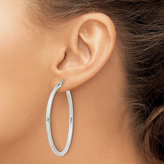 Sterling Silver Polished 2.5x45mm Hoop Earrings in an ear