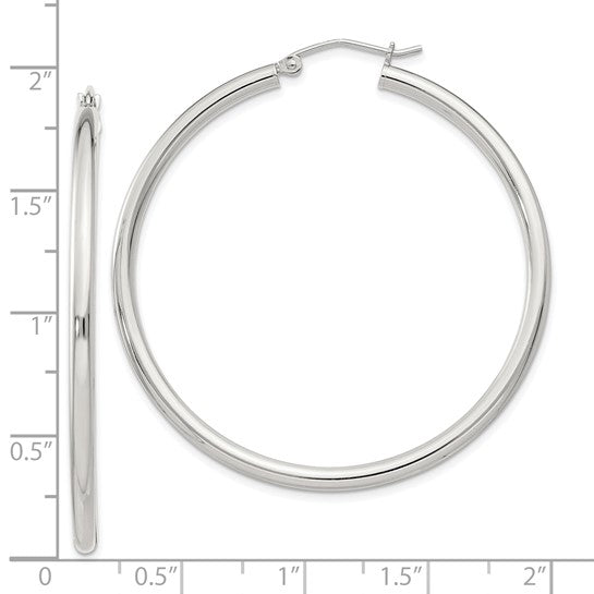 Sterling Silver Polished 2.5x45mm Hoop Earrings with a ruler to show size.