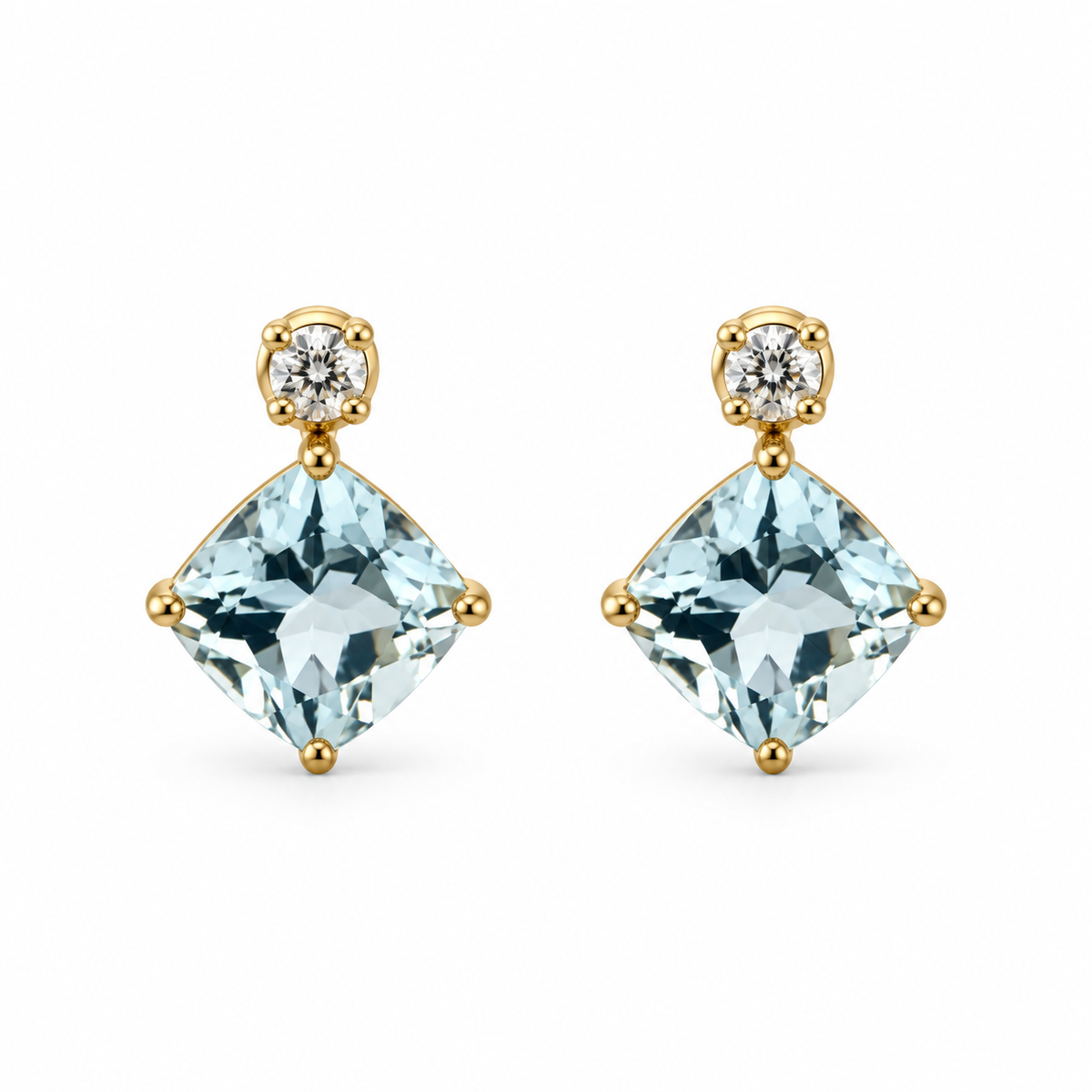 Front view of 14K yellow gold cushion aquamarine earrings with round diamond accents on a white background