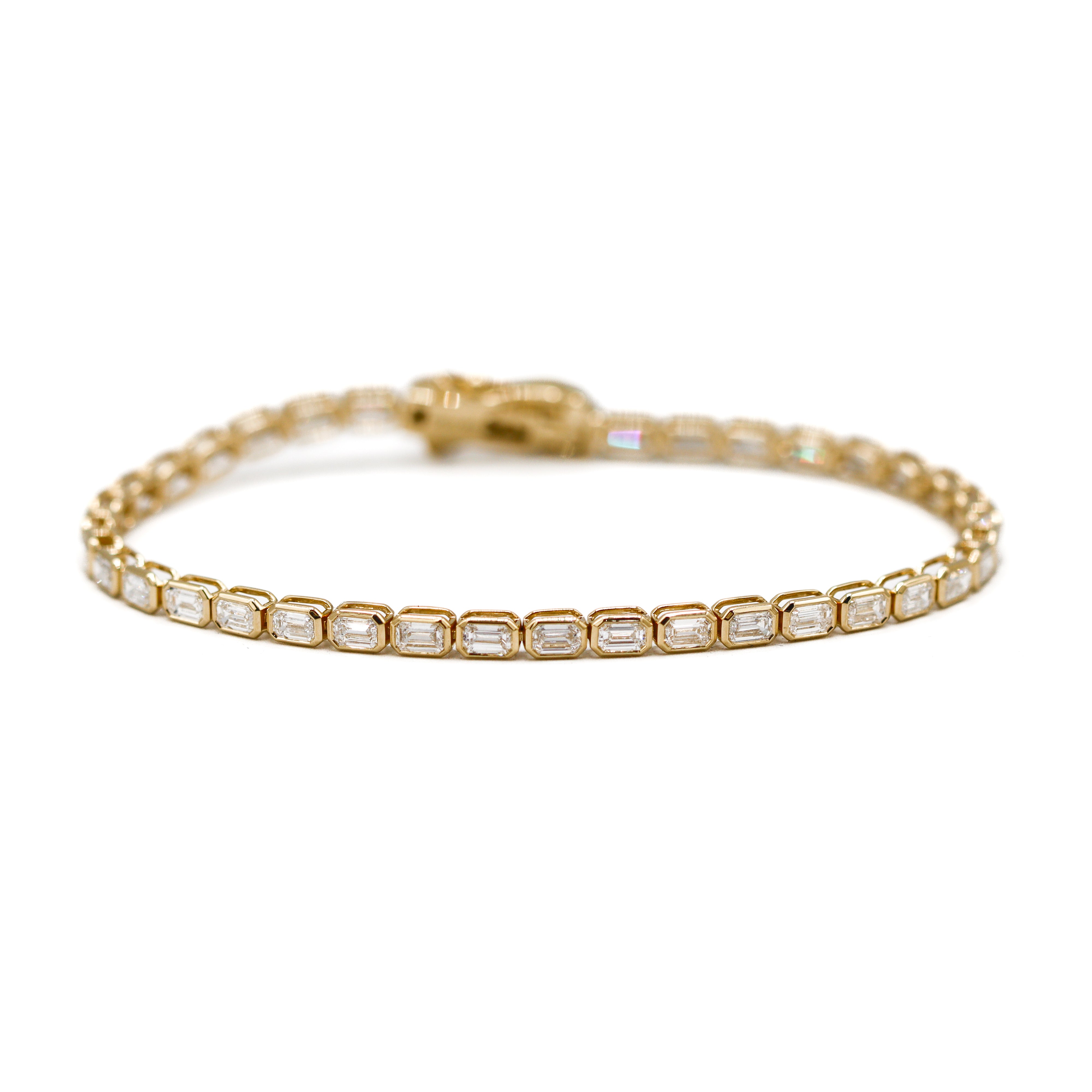 Image of tennis bracelet laying flat on a white background.