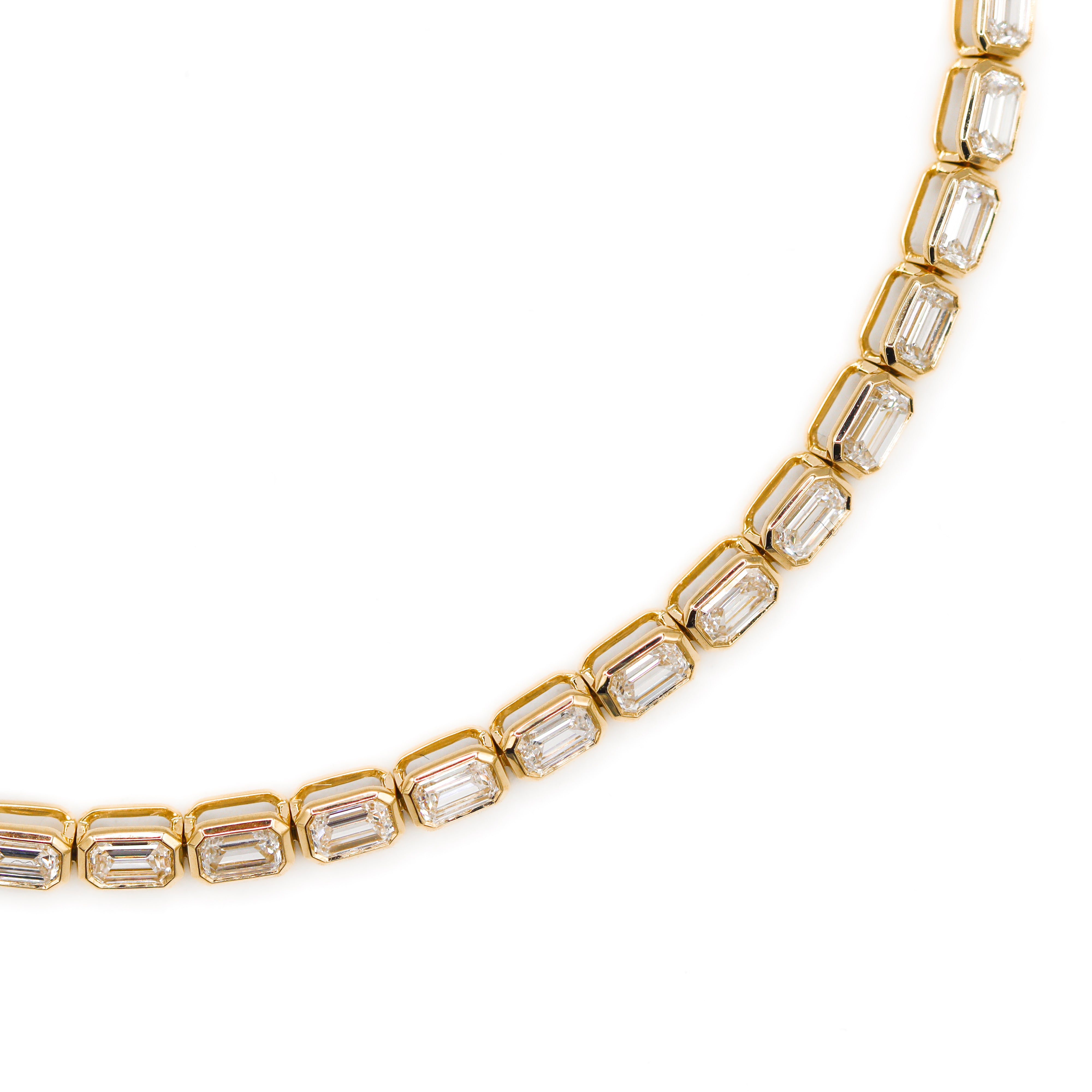 Zoomed in image showing the emerald-cut bezeled links of the tennis bracelet.