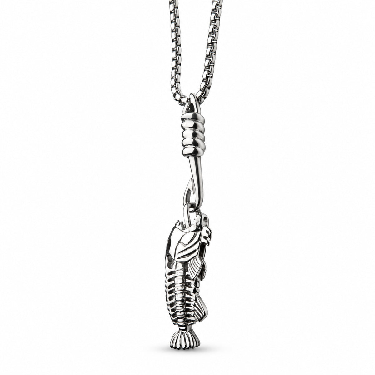 Side view of INOX stainless steel fishbone pendant showing the sculpted fish and hook detail.