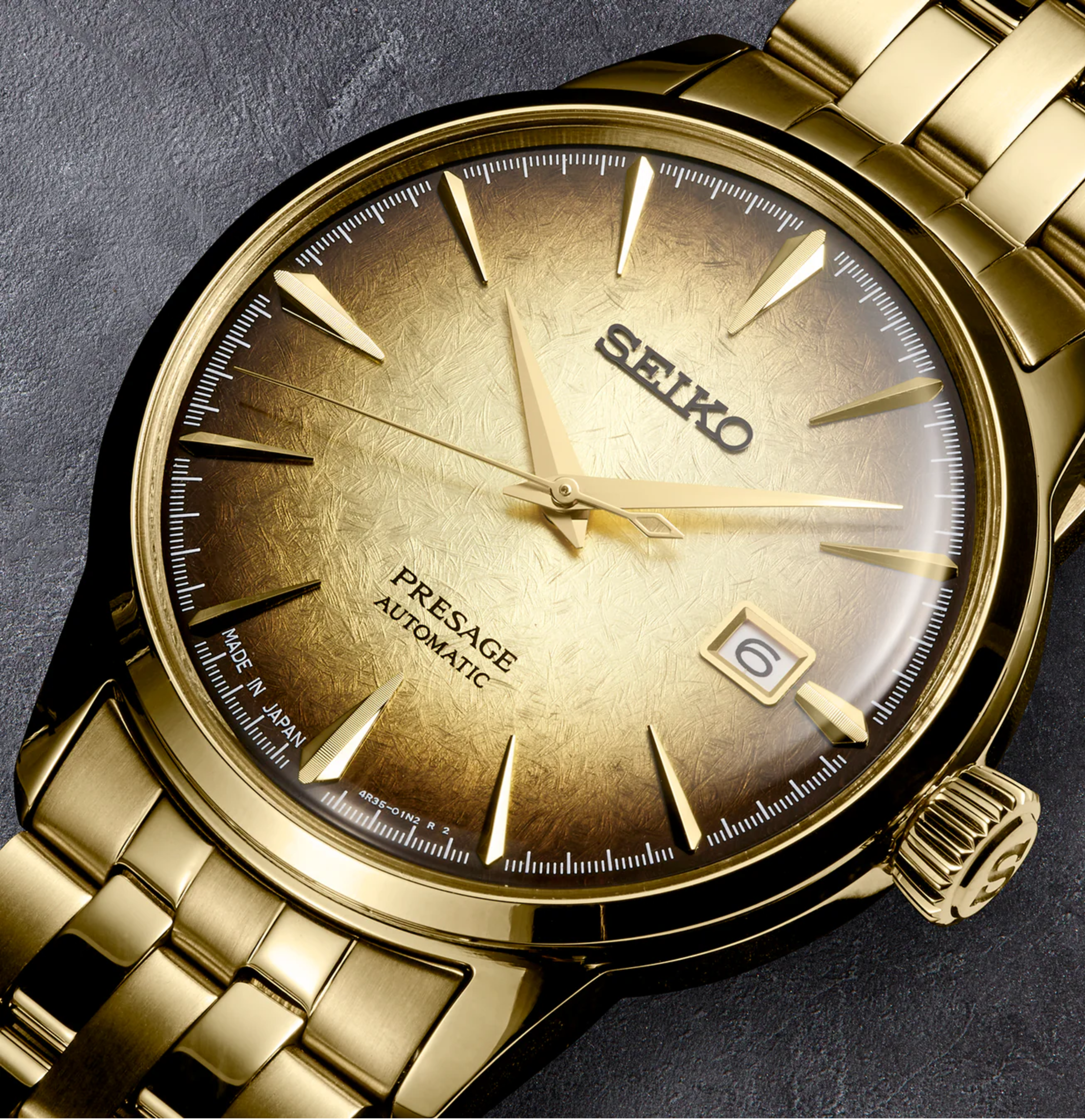 Gold Seiko watch on a dark background