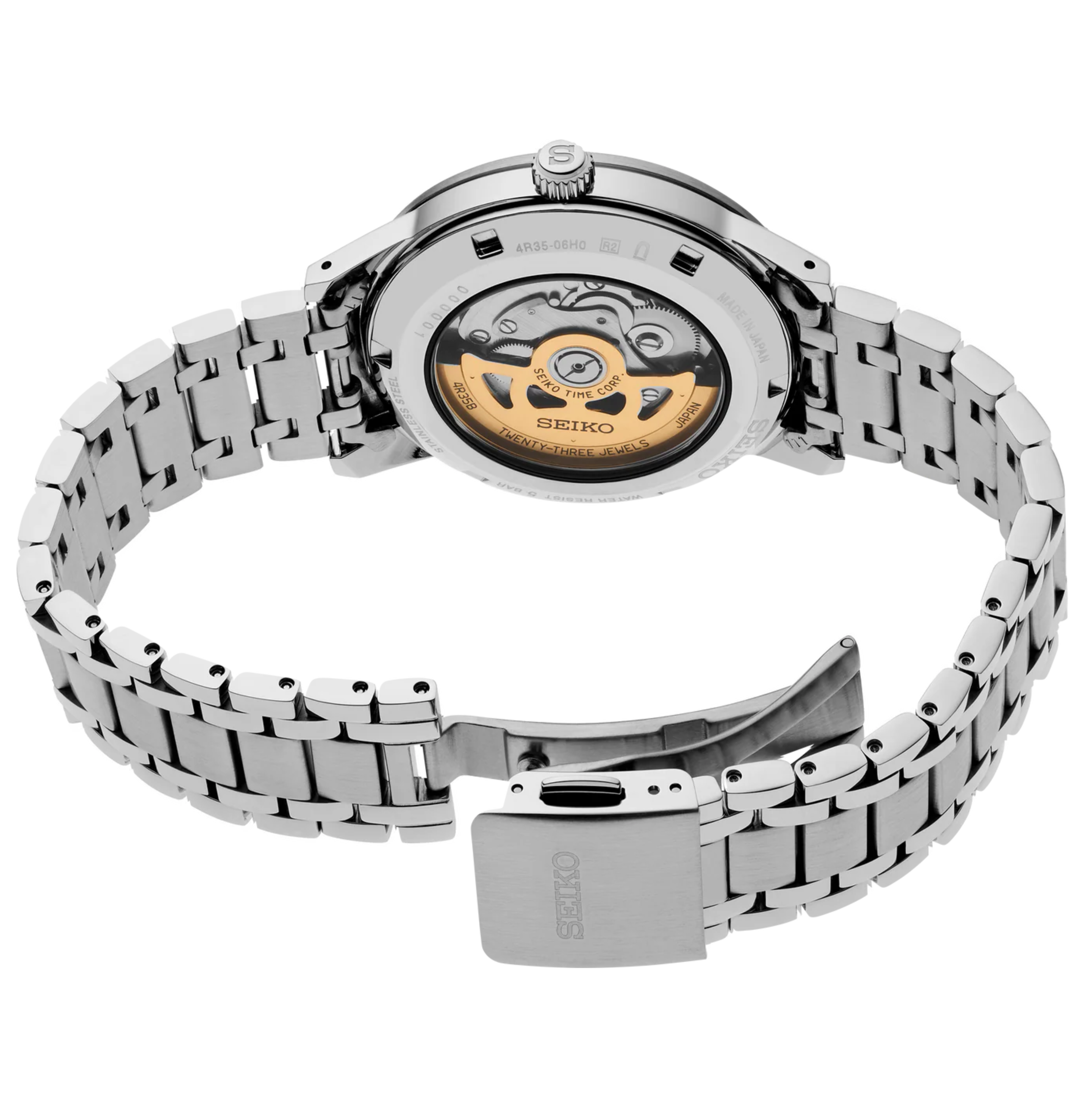 Silver Seiko watch with open face design on a white background