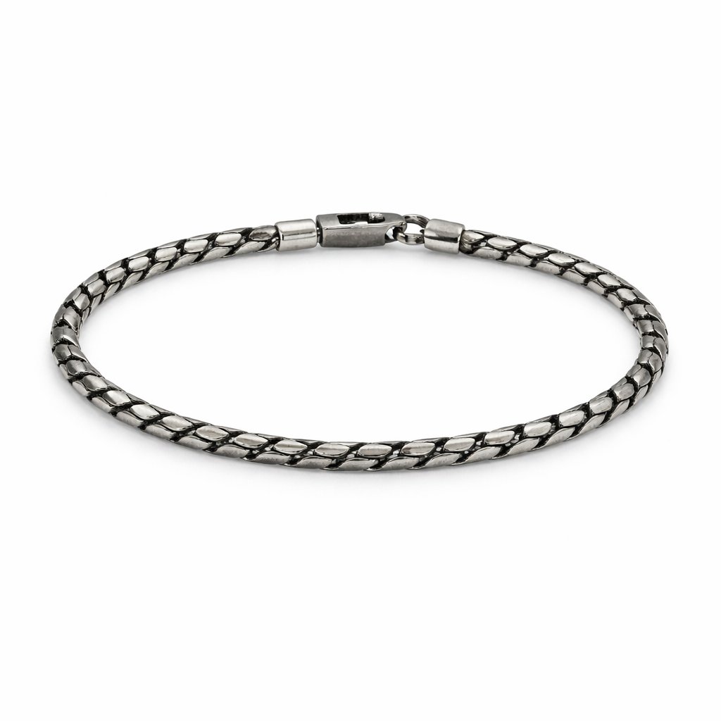 Silver chain bracelet on a white background