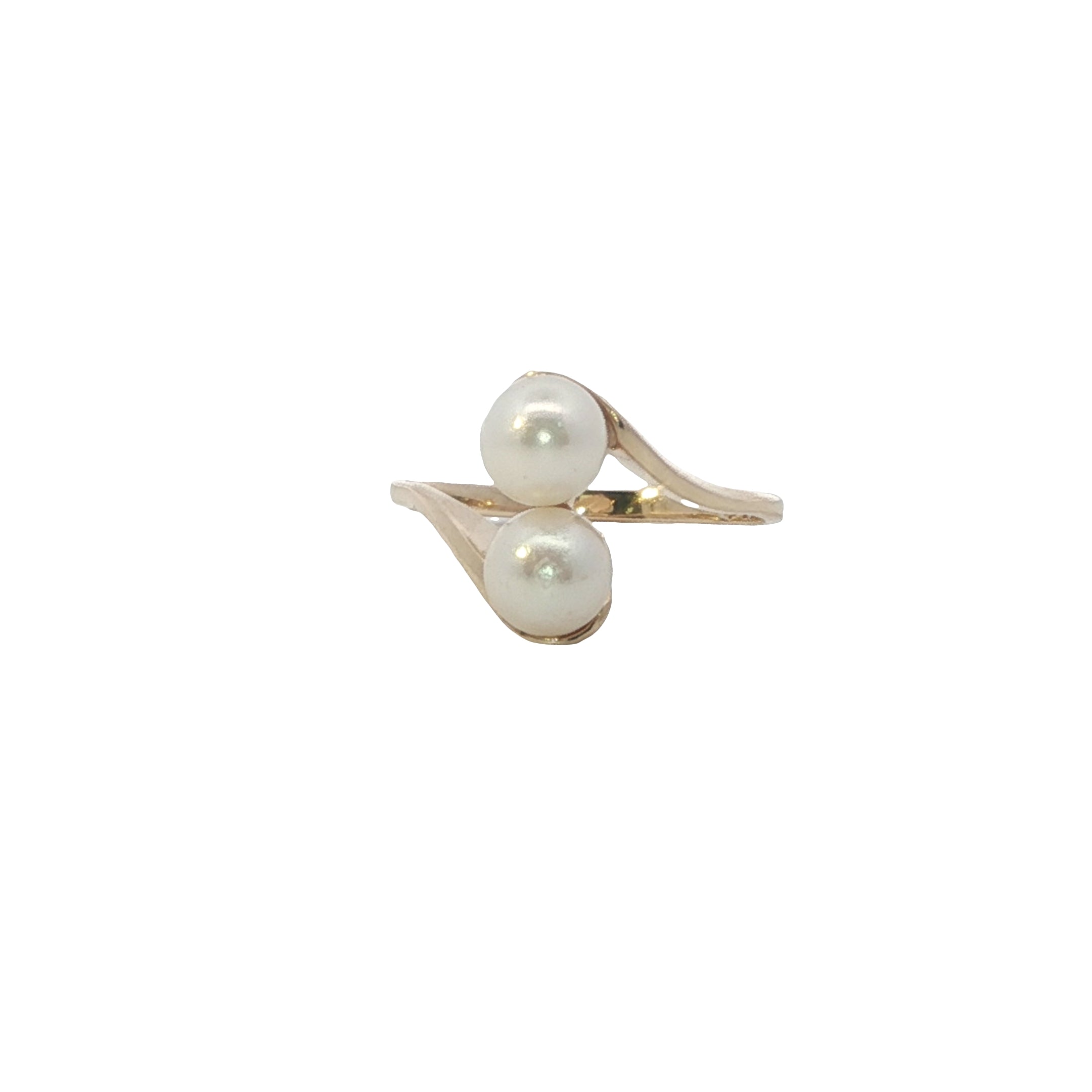 Gold ring with two pearls on a white background