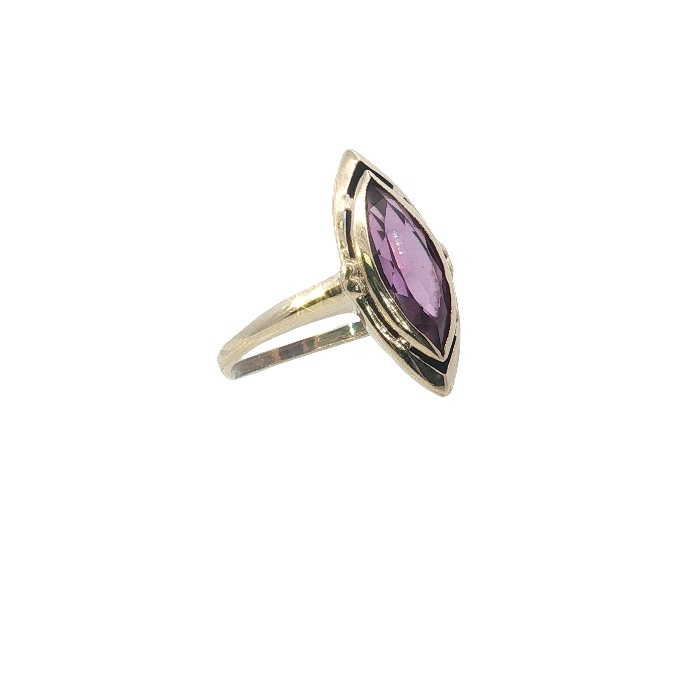 Gold ring with a purple gemstone on a white background