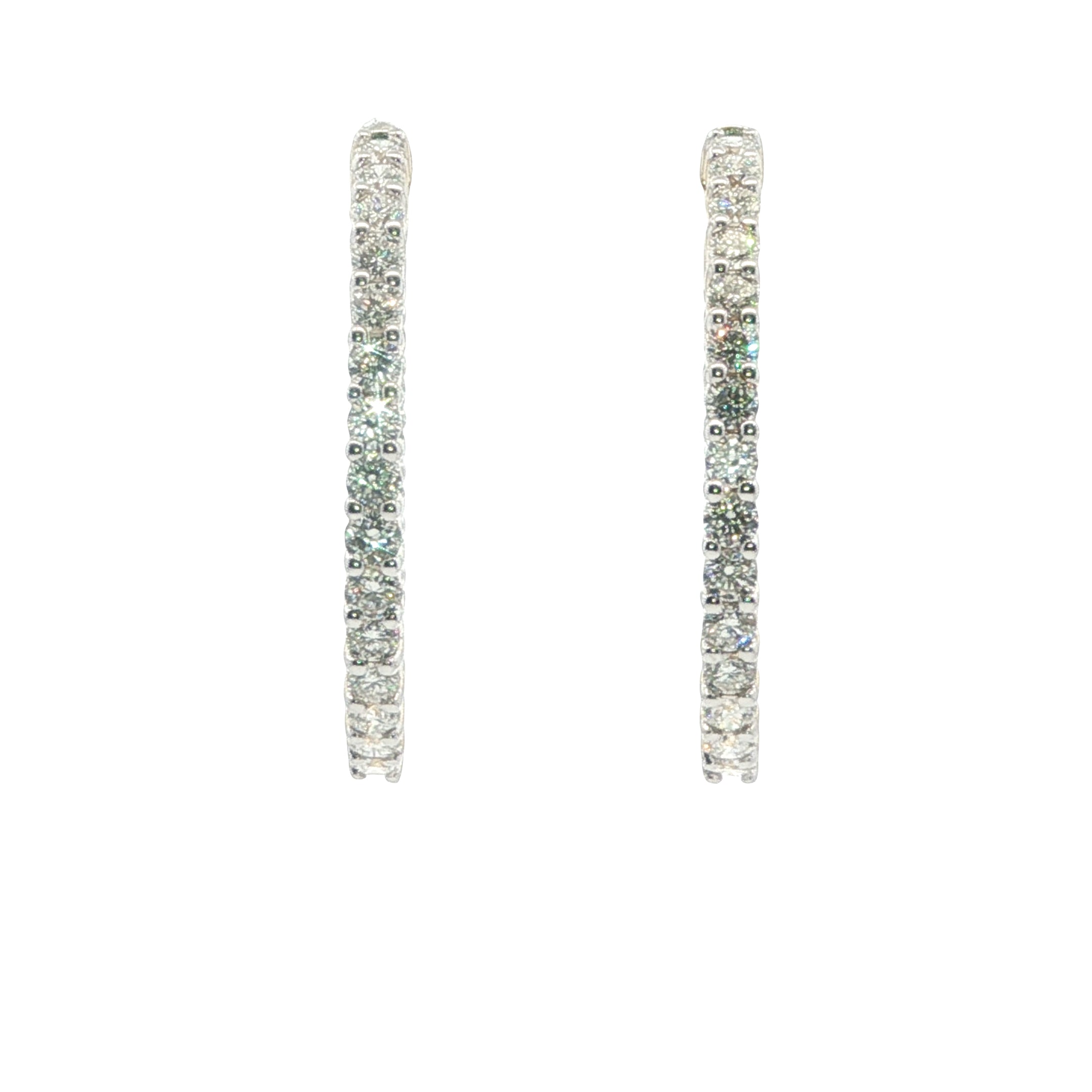 Pair of diamond hoop earrings on a white background