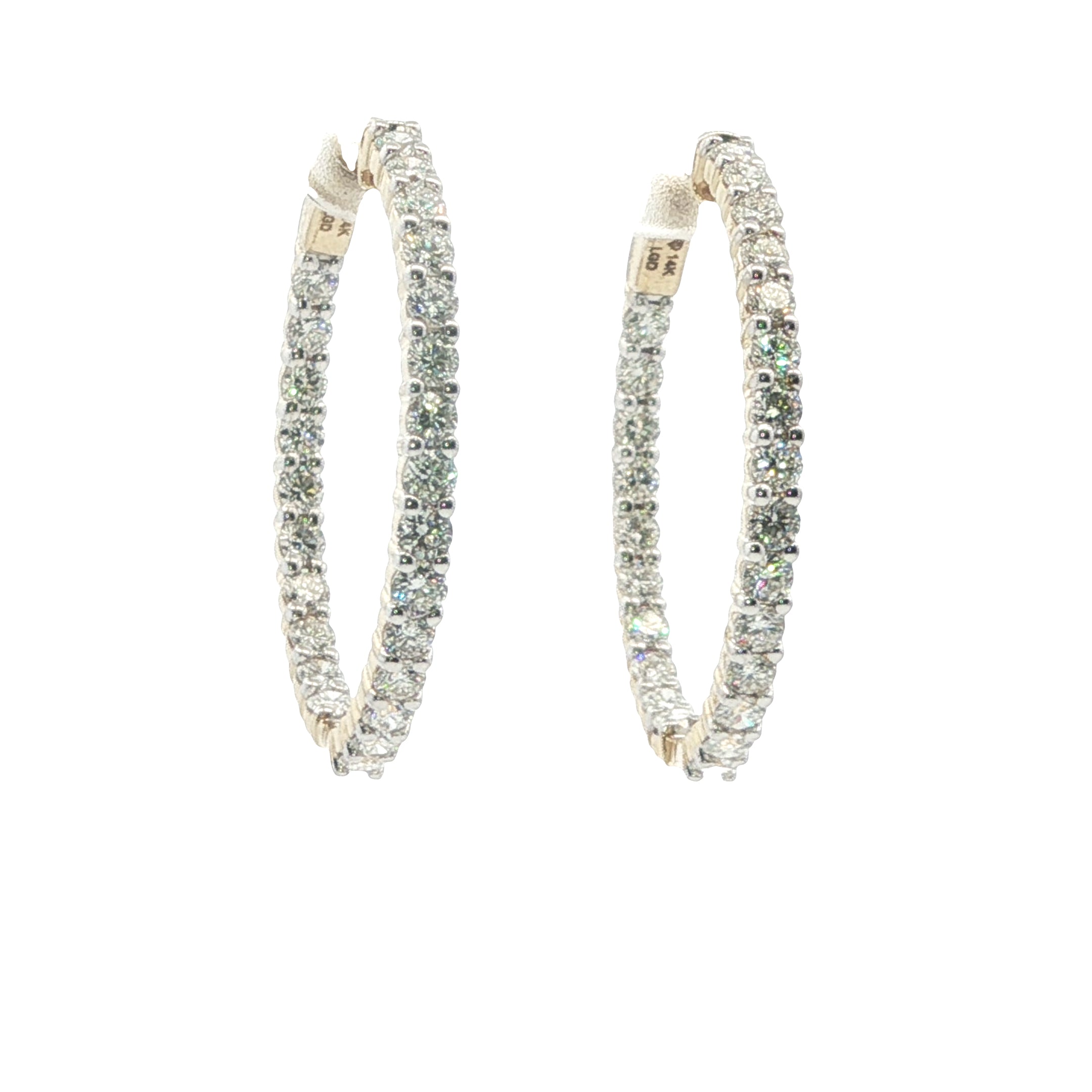 Pair of diamond hoop earrings on a white background