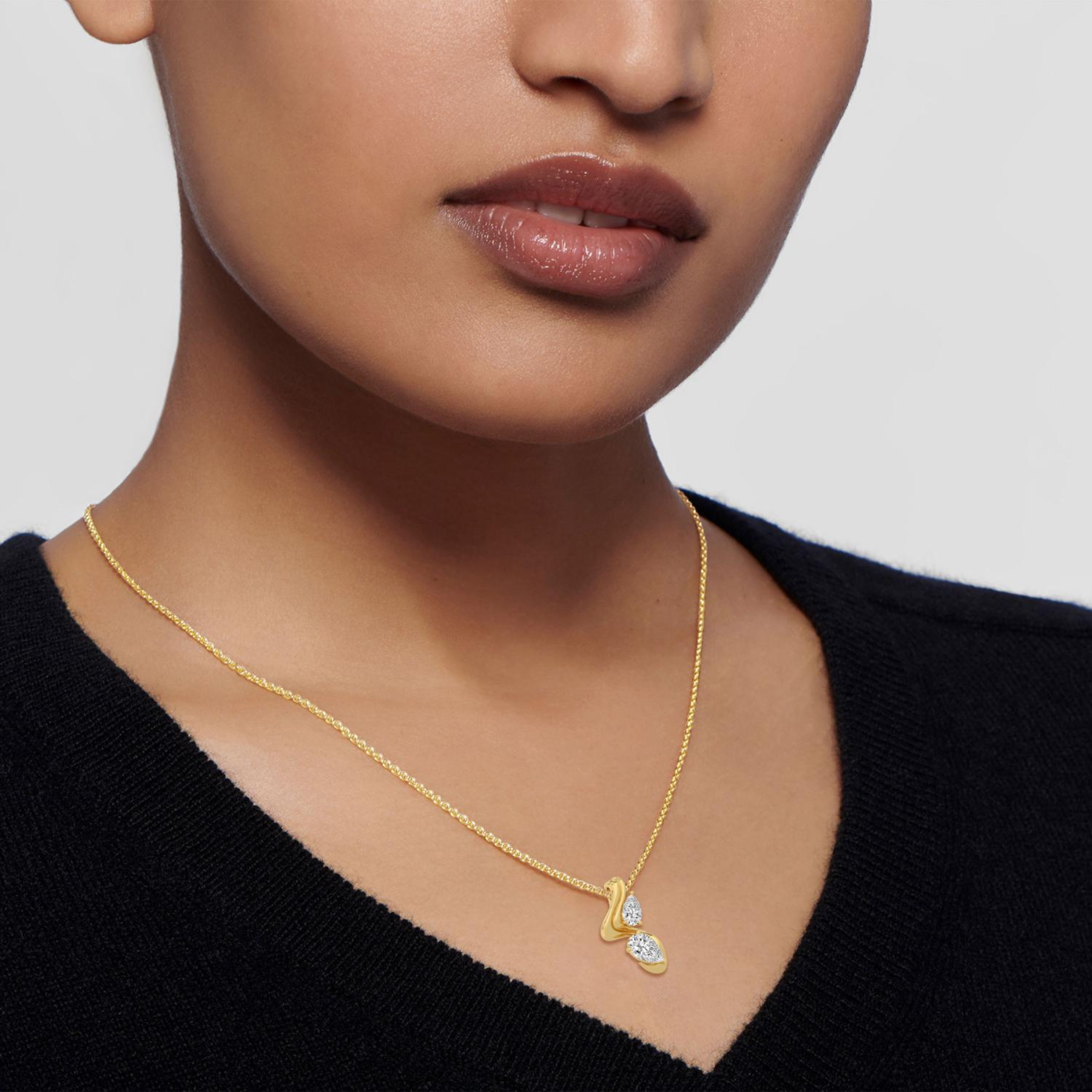 14K Yellow gold diamond necklace on white background 