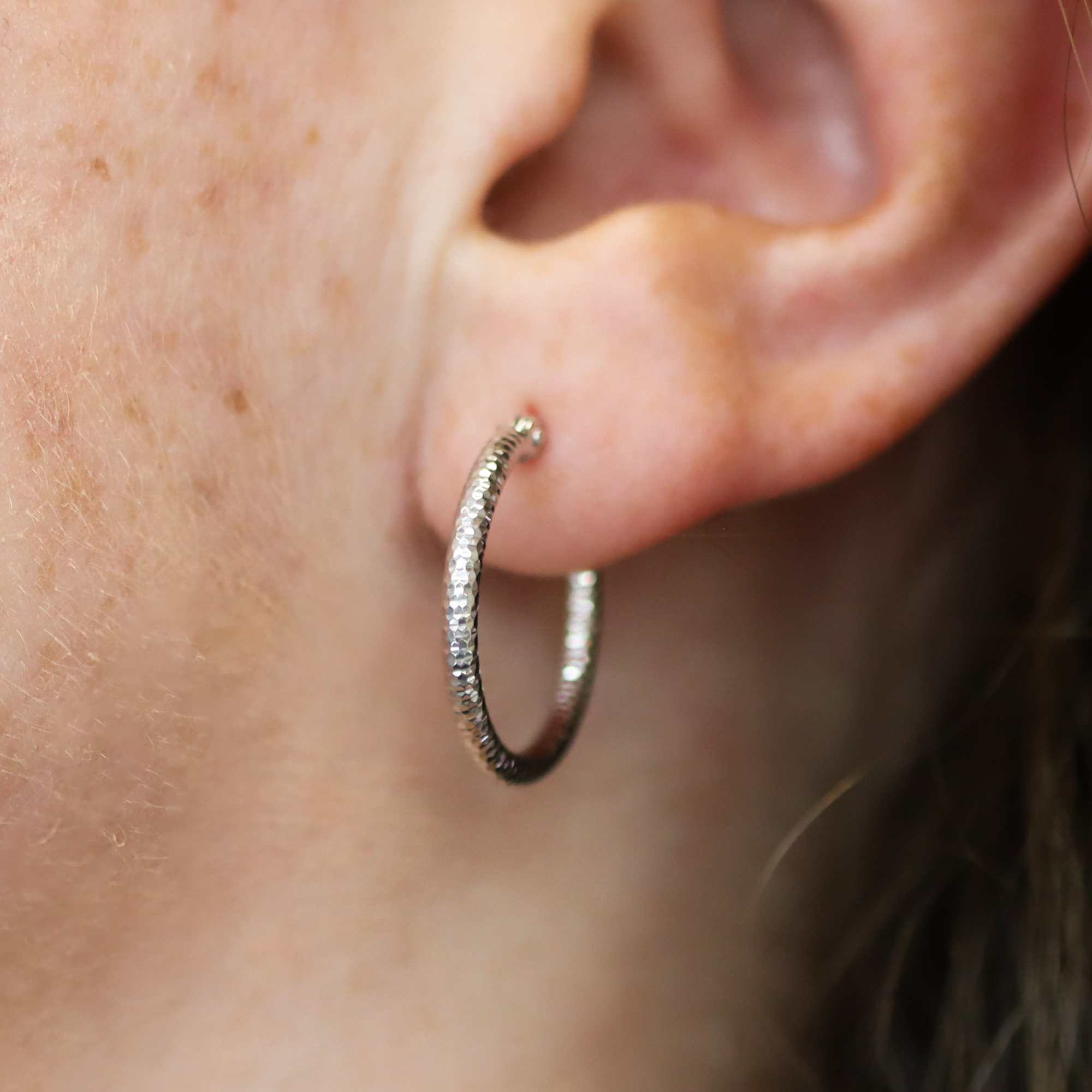 14K White Gold 2x20MM Hoops on an Ear