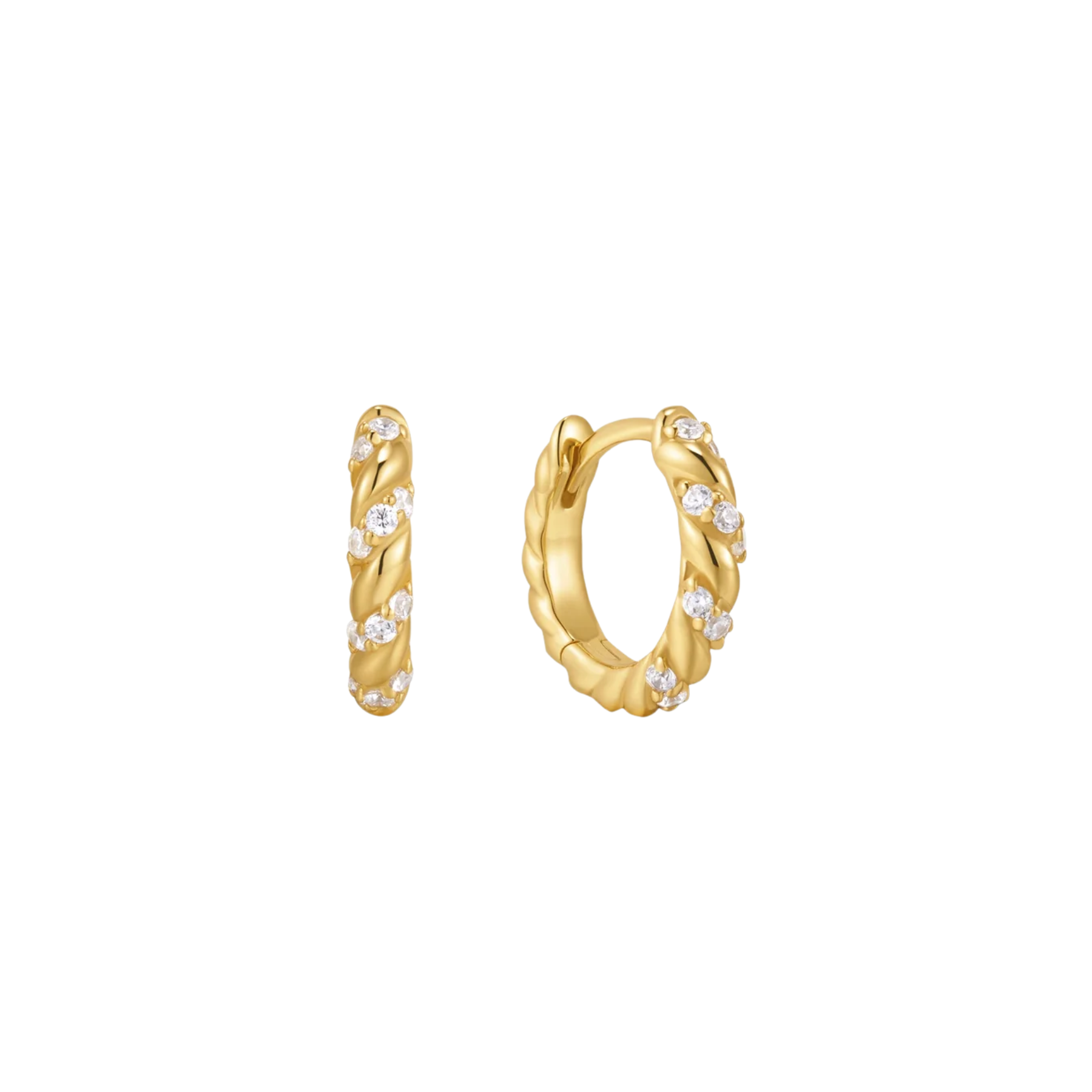 A pair of gold huggie hoop earrings adorned with cubic zirconia stones, shown on a plain white background.