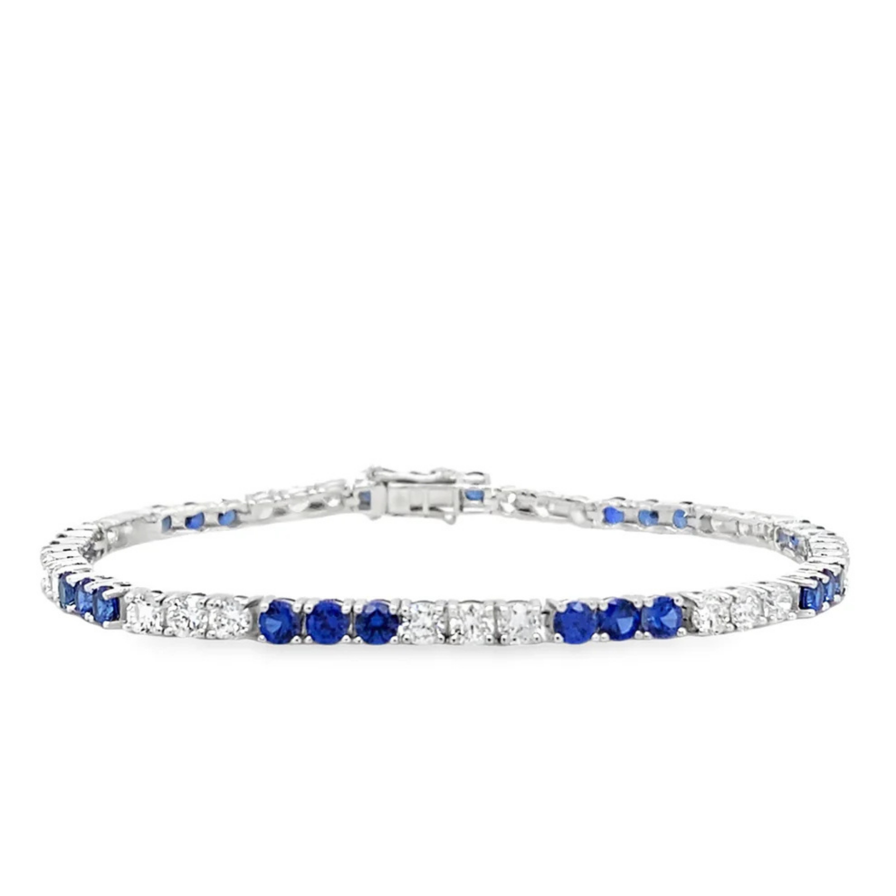 Silver bracelet with blue and clear gemstones on a white background