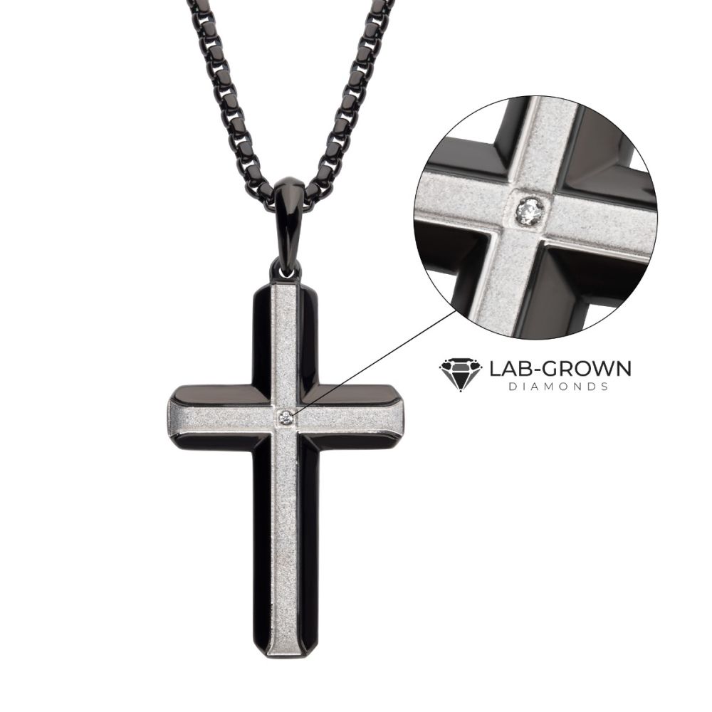 Black cross pendant necklace with lab-grown diamond on a white background