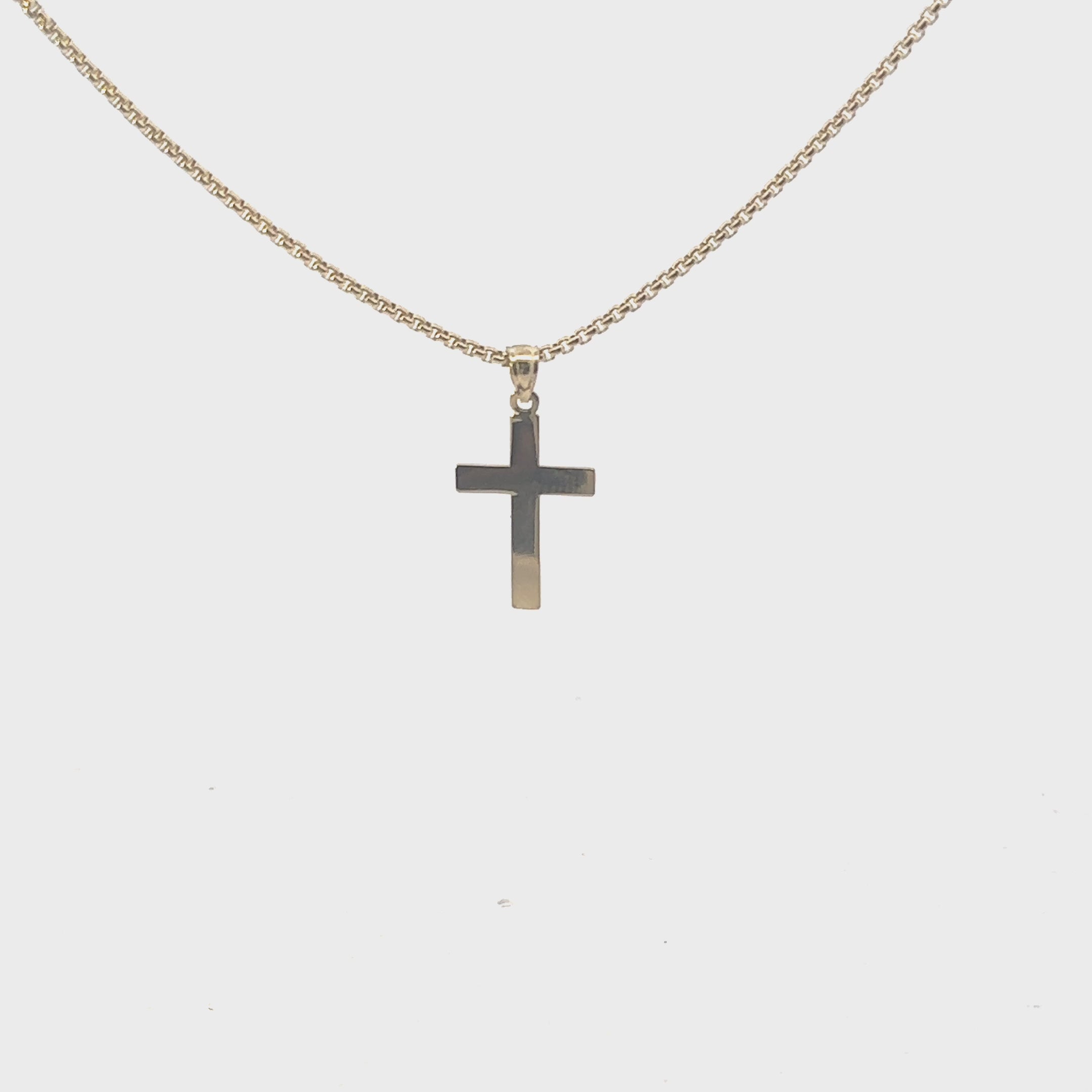 Video of cross pendant hanging on chain