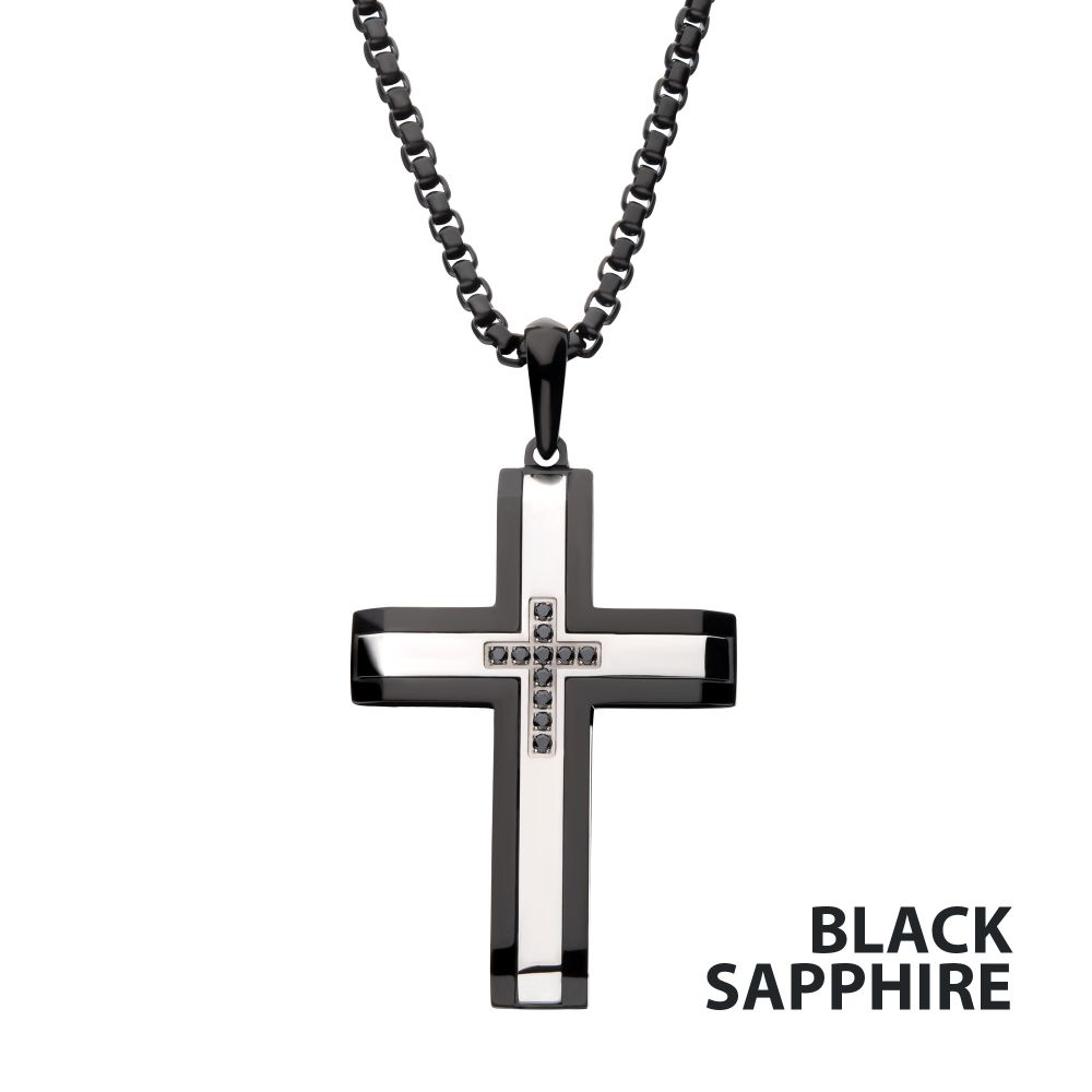 Black and silver cross pendant necklace with black sapphire stones on a white background
