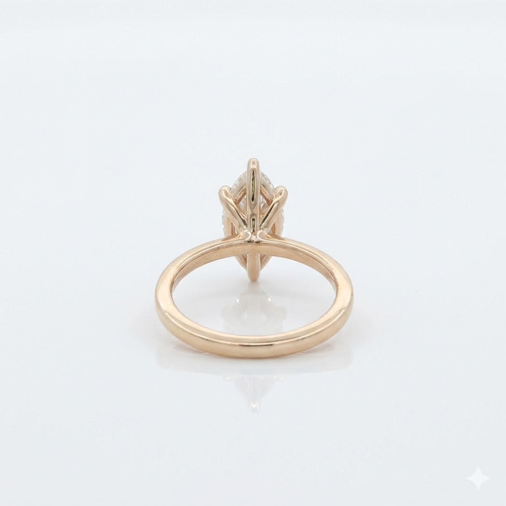 Gold ring with a diamond on a white background